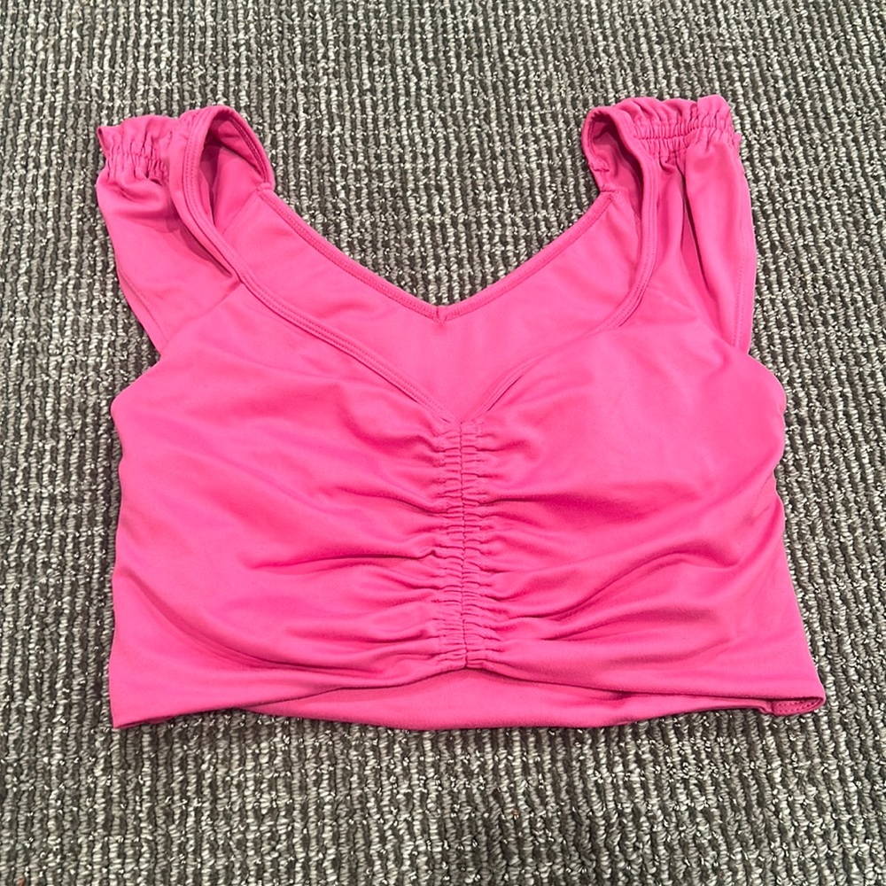 Free People pink tank top with open stomach and back